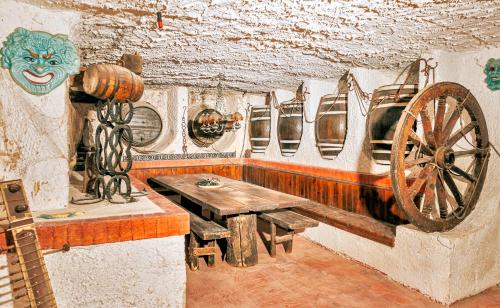 a room with a wooden bench and aoked wheel at Villa Livia in Ischia
