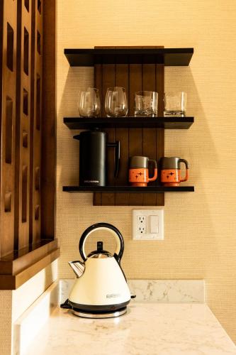 a tea kettle on a counter in a kitchen at Hotel Zed Tofino in Tofino