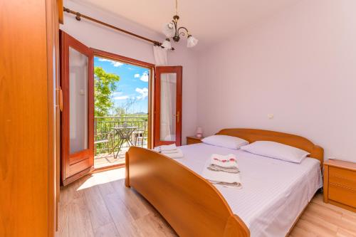 Posteľ alebo postele v izbe v ubytovaní Apartments Marina Veskovic
