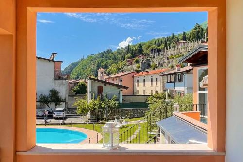 a window with a view of a city at Albergo Vittoria in Toscolano Maderno