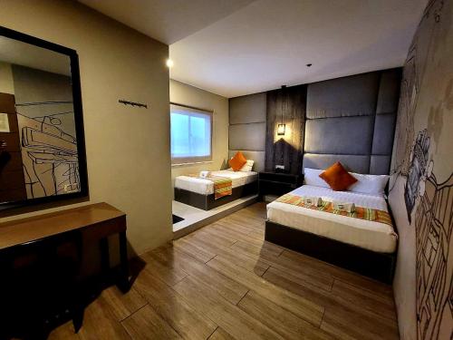 Postel nebo postele na pokoji v ubytování Dy Viajero Transient Hotel