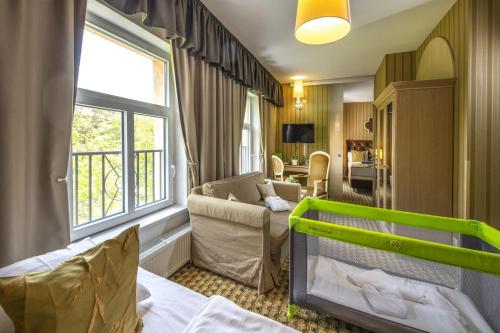 Postel nebo postele na pokoji v ubytování Oxigén Family Hotel Noszvaj