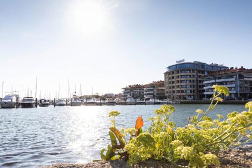 a view of a harbor with boats in the water at Laguna Palace Hotel Grado in Grado