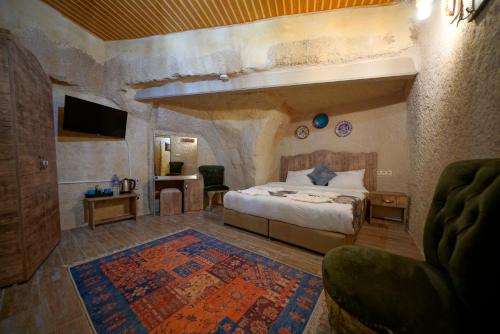 Кровать или кровати в номере Adelya Cave Hotel