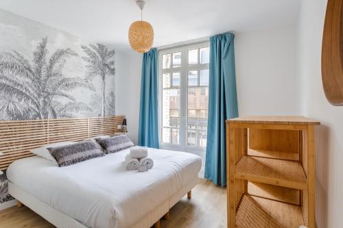 Säng eller sängar i ett rum på Résidence MALO'INN - au cœur de Saint Malo