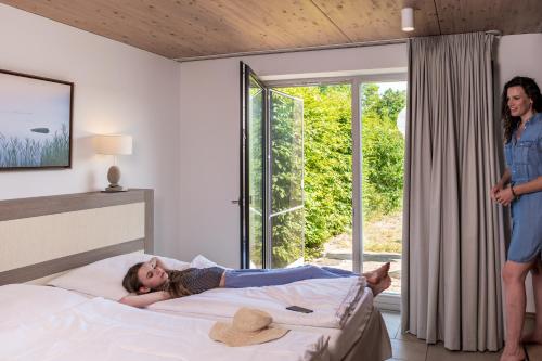 Ein Bett oder Betten in einem Zimmer der Unterkunft VILA VITA Seedorf