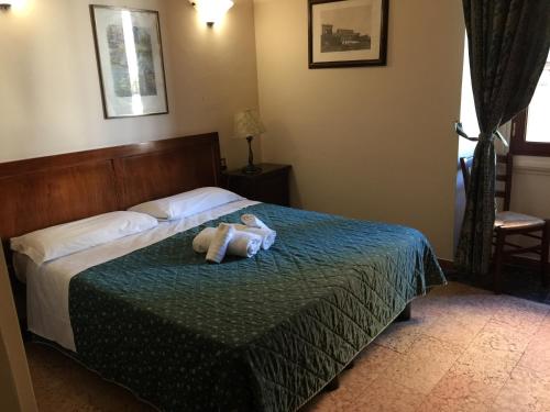 Postel nebo postele na pokoji v ubytování Hotel Le Due Fontane