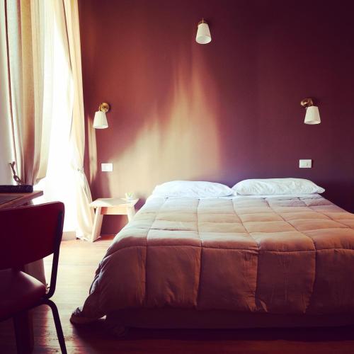 Un pat sau paturi într-o cameră la Hotel Monte Mazzoccone