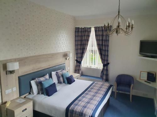 Postel nebo postele na pokoji v ubytování Sunninghill Hotel