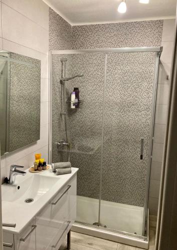 a bathroom with a shower and a sink and a showerspective at Residence Marineda Playa Cabezo in El Médano
