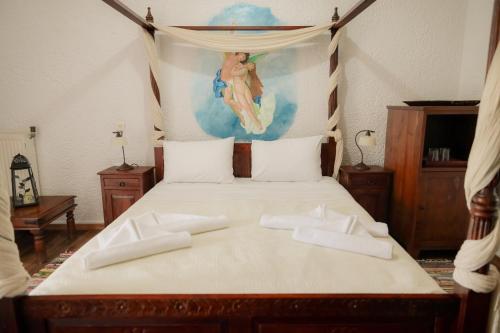 Posteľ alebo postele v izbe v ubytovaní Akrotiri B&B