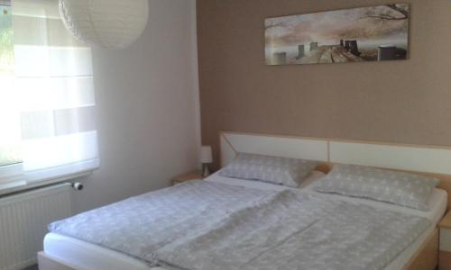 Ένα ή περισσότερα κρεβάτια σε δωμάτιο στο Ferienhaus - Roggentin