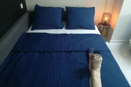 A bed or beds in a room at Appartement neuf à Boussu - Près de la France - Séjour Détente