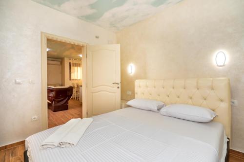 Ένα ή περισσότερα κρεβάτια σε δωμάτιο στο KAOM Lux