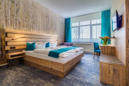 Ένα ή περισσότερα κρεβάτια σε δωμάτιο στο Panorama Ferien Hotel Harz