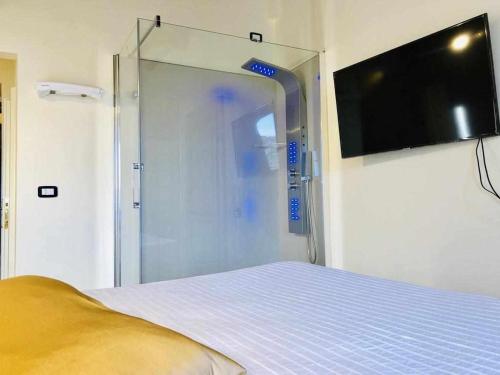 a room with a bed and a sliding glass door at Mavitur Rooms Assisi in Assisi