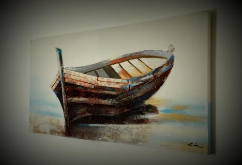 a painting of a boat sitting on the water at PESCA AZZURRA in Terrasini