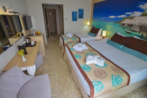 a hotel room with two beds and a view of the ocean at Hotel Izgrev Spa & Aquapark in Struga