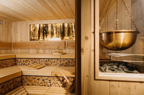 a sauna with a bowl on top of it at Hotel Forsthaus Nürnberg Fürth in Fürth