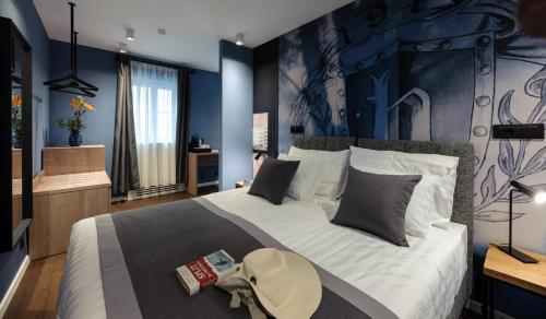 Postel nebo postele na pokoji v ubytování Camera Hotel