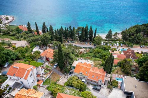 an aerial view of a house next to the ocean at Apartments Katica in Mlini