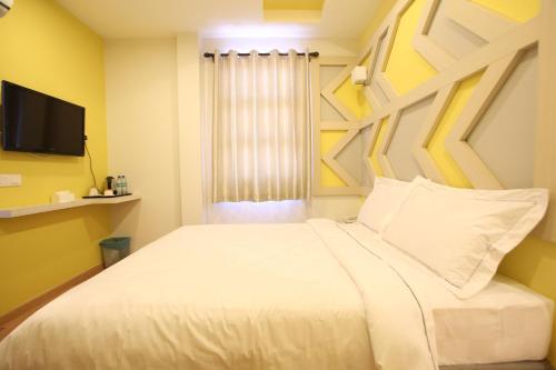 Sunshine Inn Plusにあるベッド