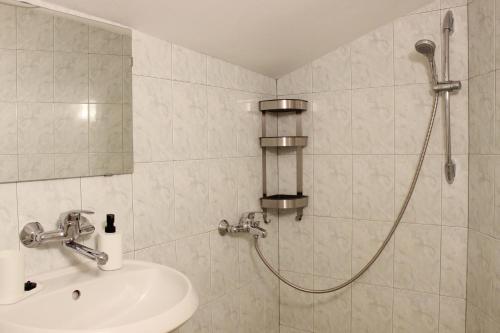 a bathroom with a shower and a sink at Villa Apollonia in Sozopol