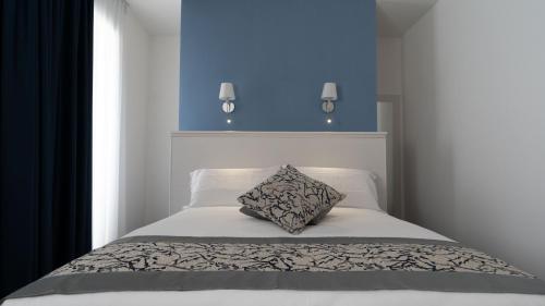 Postel nebo postele na pokoji v ubytování Palazzo Cappuccini Art Relais