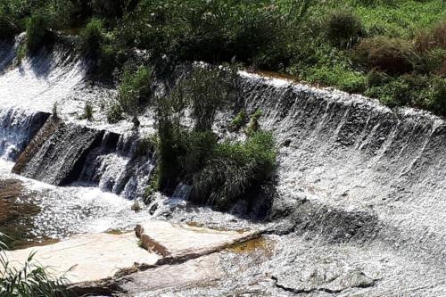 a waterfall in the middle of a river at JERICA ALOHA in Jérica