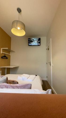 Postel nebo postele na pokoji v ubytování Junqueira76 Guesthouse