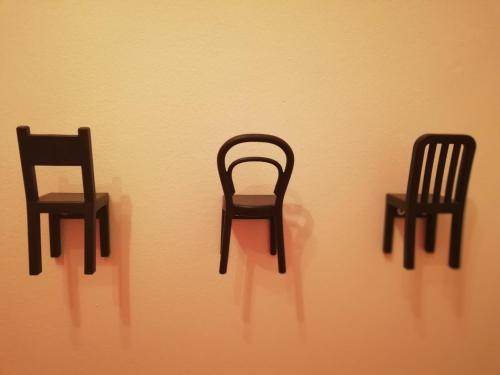 a couple of chairs sitting on a wall at Nest in Belgrade