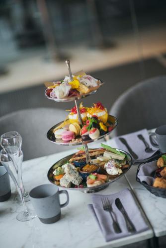 a table with three plates of food on a table at Best Western Plus Savoy Lulea in Luleå