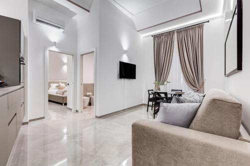 TV a/nebo společenská místnost v ubytování UnoSeiTre - Luxury Apartment & Suite