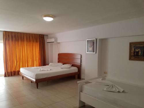 Katil atau katil-katil dalam bilik di Apartamente Duplex Berti