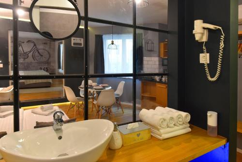 a bathroom with a sink and a mirror at Walk Inn Váci 78 in Budapest