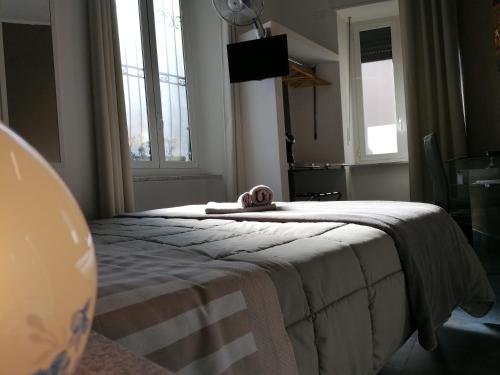 Ένα ή περισσότερα κρεβάτια σε δωμάτιο στο B&B IL SOGNO