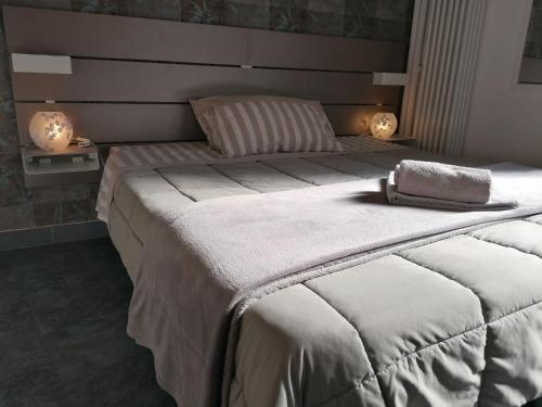 Ένα ή περισσότερα κρεβάτια σε δωμάτιο στο B&B IL SOGNO