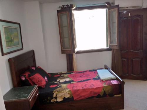 a bedroom with a bed and a window at 1B studio 2beds air conditioned basement114 green beach in El Alamein