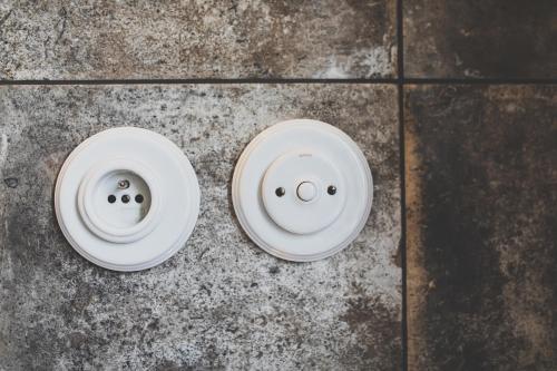two white sinks sitting on a concrete floor at Penzion Šatlava in Nové Město nad Metují