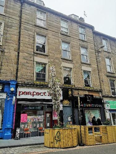 a large brick building on the side of a street at aabAlree Guest House in Dundee