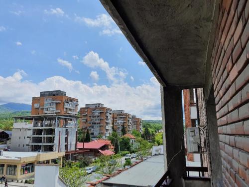 a view of a city from a building at Petrosani Camere de Inchiriat - Hotel Petroshani srl in Petroşani