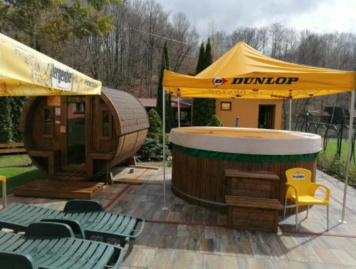 a sauna and a circular building with a tent at Pensiunea Colt Alb in Băile Homorod