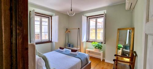 En eller flere senge i et værelse på Casa do Alfaiate ® Home&Breakfast