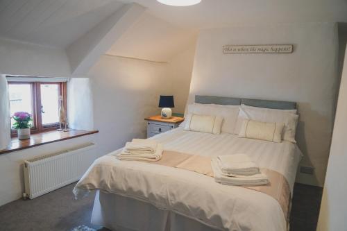 Tempat tidur dalam kamar di 'The Cottage'