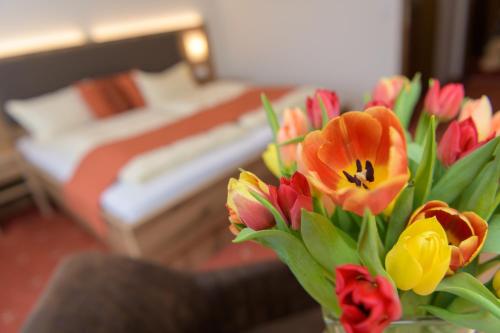 Postel nebo postele na pokoji v ubytování Hotel Sonnbichl