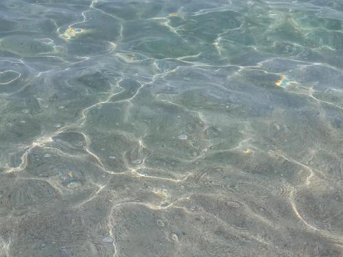 a close up of the water with rocks at Appartamento in zona residenziale in Orosei