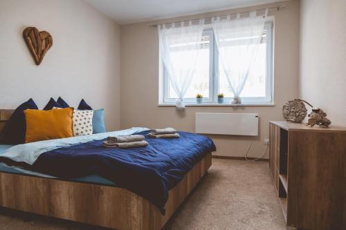 A bed or beds in a room at Apartmán Zara