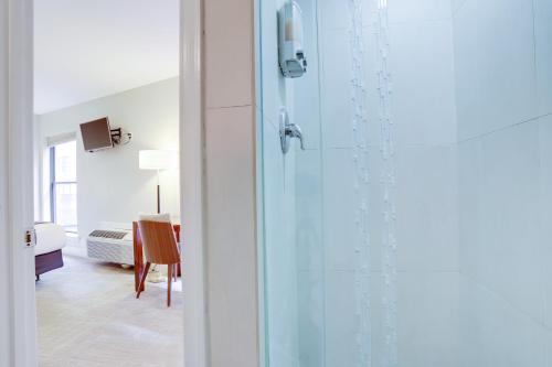 a glass door leading into a room with a table at Sojourn at DuPont Place in Washington