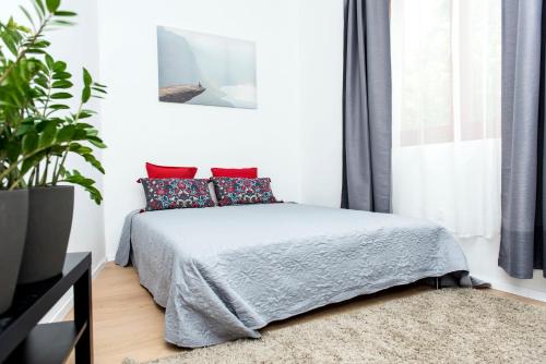 Posteľ alebo postele v izbe v ubytovaní K88 Apartman