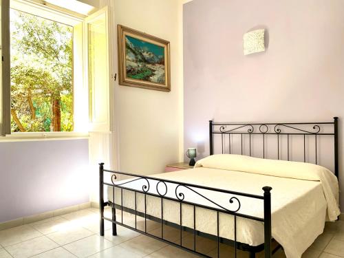 Ένα ή περισσότερα κρεβάτια σε δωμάτιο στο Villa Rocco Rooms